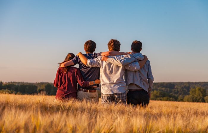 unknown persons standing outdoors