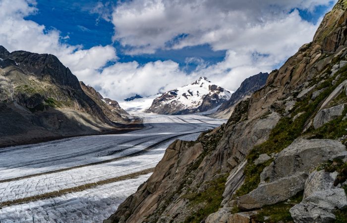 snow covered mountain under cloudy sky during daytime